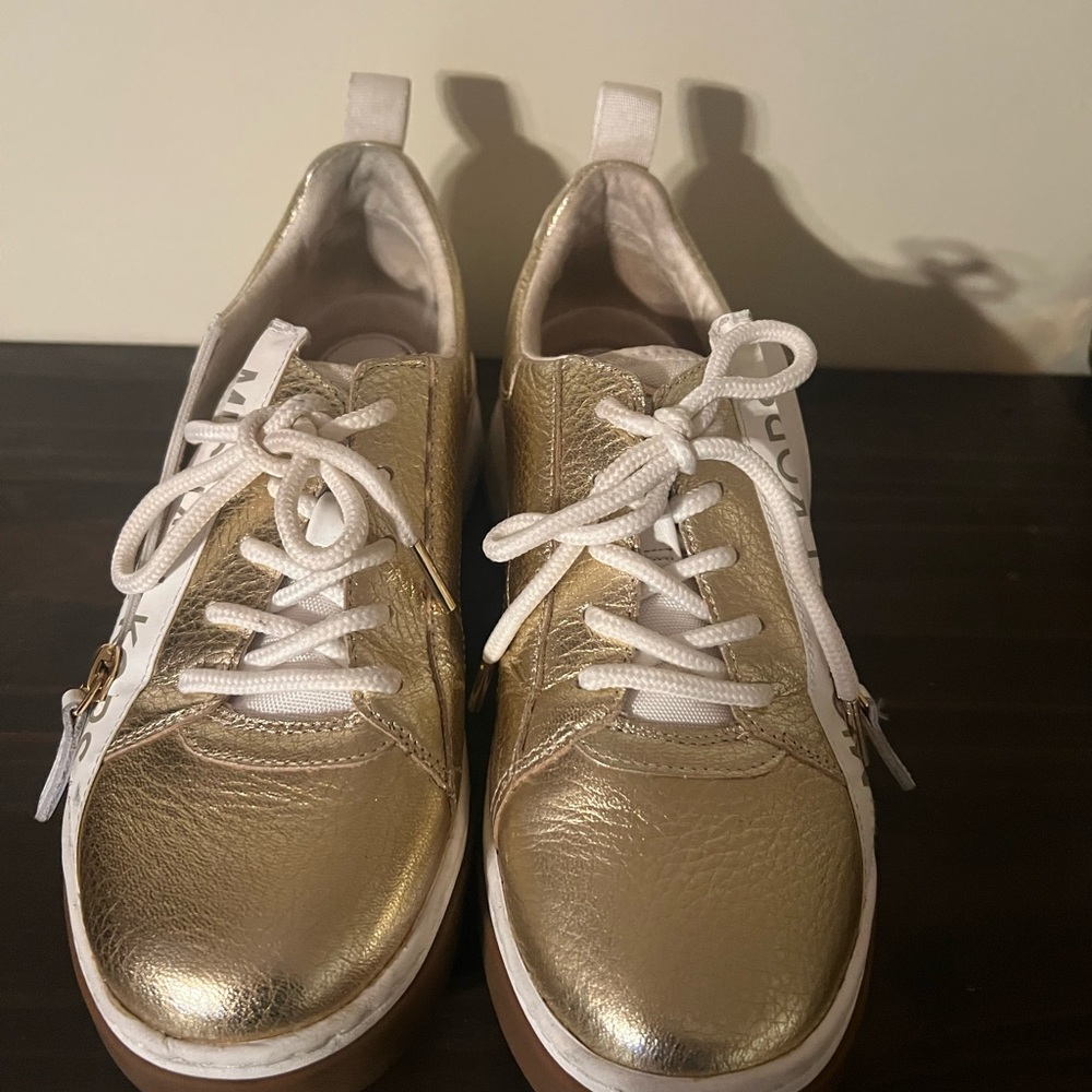 Beautiful leatherr gold and white Michael Kors casual shoes.